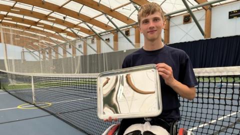 Ruben Harris on a tennis court 