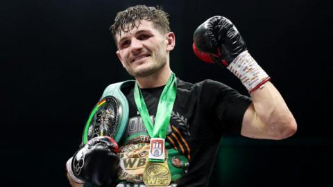 Lee Cutler celebrates with his new WBC International title after victory over Stephen McKenna