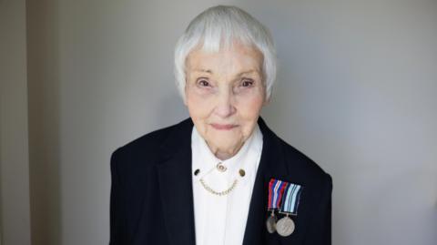 Anne Puckridge wearing her military medals