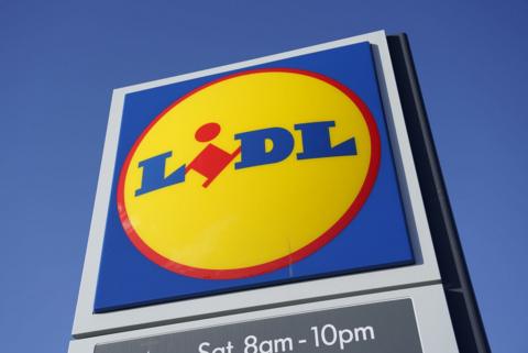 Outdoor logo of Lidl with the superstore's name in blue and red aginst a yellow circle and blue square