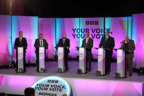 Candidates at their podiums for the debate