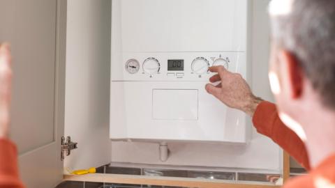 Person working on a boiler.