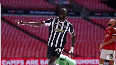 Alassana Jatta of Notts County celebrates scoring his team's first goal during the League Two play-off final between Notts County and Salford City.