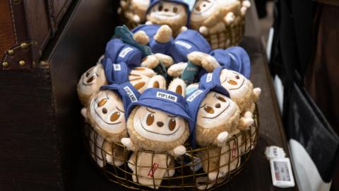 A basket filled with Labubu toys - plush toys of monster elves