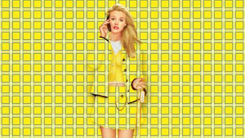 Alicia Silverstone as Cher in Clueless, she is wearing a yellow tartan outfit, which is superimposed onto the background of the image.