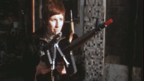 Diane Harron holds a toy gun