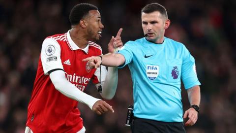 Gabriel of Arsenal argues with referee Michael Oliver after awarding a penalty during the Premier League match between Arsenal and West Ham United