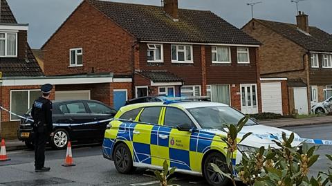 Police outside an address on Adelaide Drive