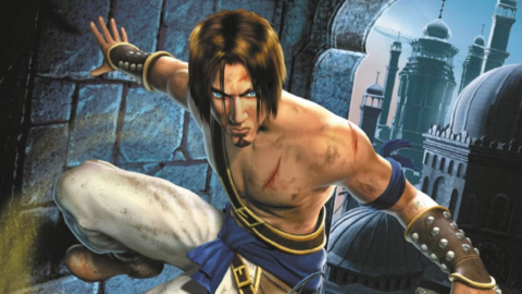 A video game character wearing garb referencing historic Middle Eastern attire. He has blue eyes and a long brown fringe. In the background, a city scene with buildings in a historic Persian style.