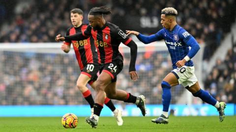 Bournemouth's Antoine Semenyo battles with Ipswich Town's Omari Hutchinson