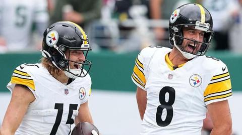 Ben Skowronek and Aaron Rodgers celebrate a touchdown for the Pittsburgh Steelers against the New York Jets