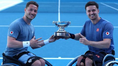 Alfie Hewett and Gordon Reid hold their Australian Open trophy