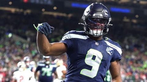 Kenneth Walker celebrates