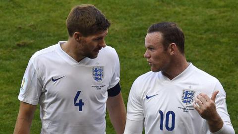 Steven Gerrard and Wayne Rooney talk after a 2014 World Cup game against Costa Rica