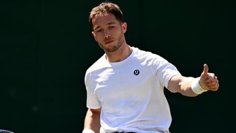 Briton Alfie Hewett playing in wheelchair men's singles on court three at Wimbledon