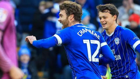 Calum Chambers (left) celebrates scoring for Cardiff against Wigan