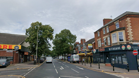 A streetview image of Melton Road. A white van is driving away and a restaurant  is also pictured.