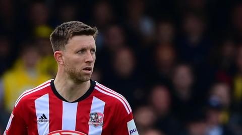 Will Aimson in action for Exeter City