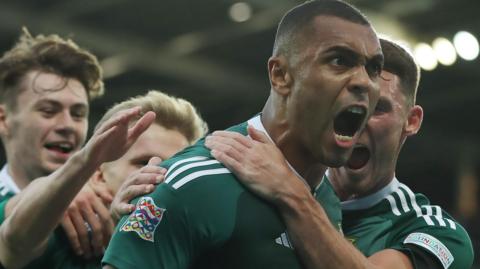 Josh Magennis celebrates scoring against Kosovo at Windsor Park in 2022