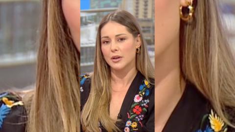 TV personality Louise Thompson has long blonde hair and is wearing a black top.