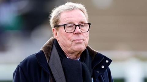 Harry Redknapp watches his horse 'Bowtogreatness' run in the Timeform Novices' Handicap Chase as he attends Festival Trials Day at Cheltenham