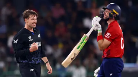 Lockie Ferguson celebrates the wicket of Jos Buttler