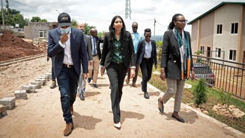 Then-˿ Secretary Suella Braverman tours a building site on the outskirts of Kigali during her visit to Rwanda in March 2023