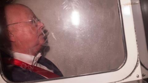 Side view on man with glasses