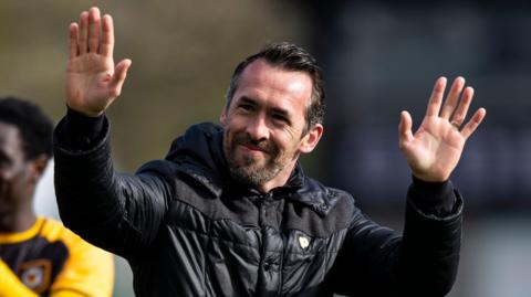 Christian Fuchs waves to the Newport County fans