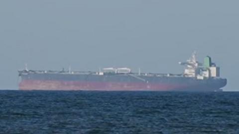 Screengrab of a file image showing a ship with a red base in water.