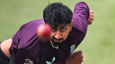 Shoaib Bashir bowling for England during training at the MCG