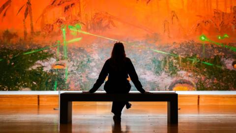 A woman views a work by nominated artist Mohammed Sami during the press preview for the Turner Prize 2025 at Cartwright Hall Art Gallery in Bradford.