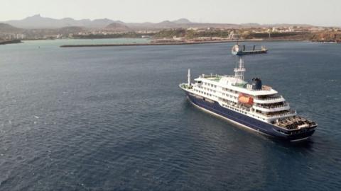 The cruise ship can be seen off Cape Verde