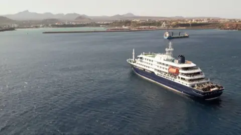 The cruise ship can be seen off Cape Verde