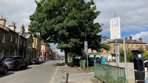 A shot of Caroline Street with the car park on one side and terraced houses on the other