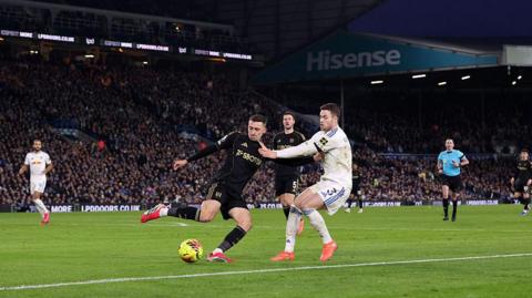 Timothy Castagne of Fulham battles for possession with Gabriel Gudmundsson