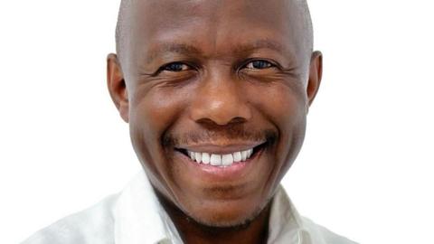 Humphrey Polepole in a white shirt