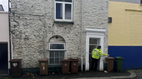 Police officer at a cordon on Rendle Street, Plymouth