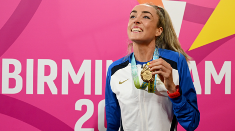 Team Scotland athlete Eilish McColgan smiles with a Commonwealth Games gold medal