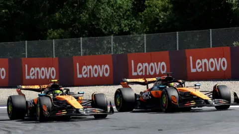 Lando Norris wuns his hand through his hair after winning the Austrian Grand Prix