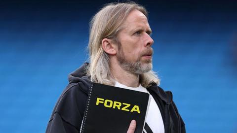 Austin MacPhee, set-piece coach of Aston Villa, looks on from the touchline