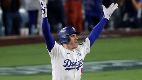 Freddie Freeman celebrates after hitting his walk-off home run for the Los Angeles Dodgers
