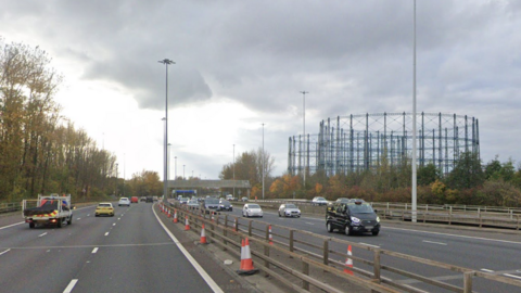 Cars and trucks travel along the M8 motorway