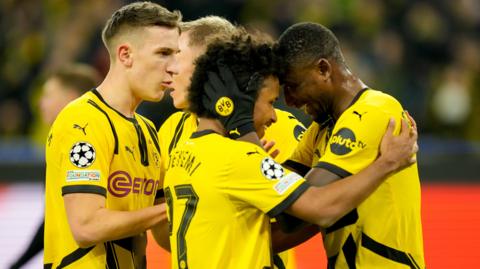 Serhou Guirassy of Borussia Dortmund celebrates after scoring.