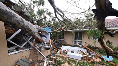  Debris from a house damaged by a  fallen gum tree.