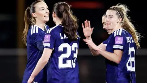Scotland celebrate Caroline Weir's goal