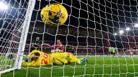 A ball hits the net for a goal in a Premier League game