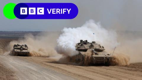 Israeli armoured fighting vehicles make their way to the northern Gaza Strip