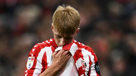 Tommy Watson leaving the field, holding his shirt up to his mouth, in Sunderland's draw with Bristol City. 