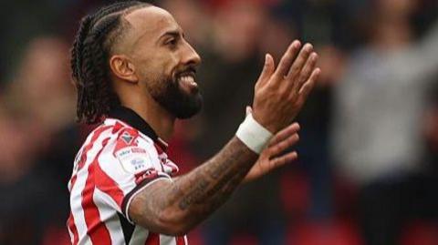 Sorba Thomas celebrates